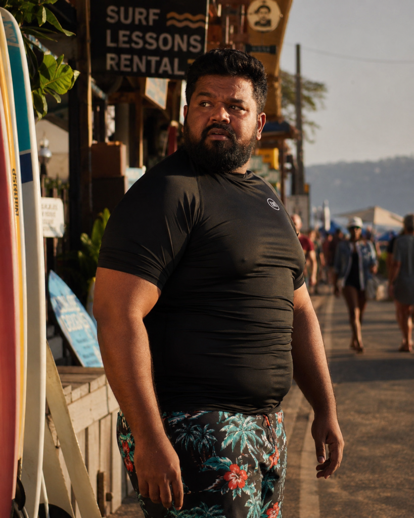 Black Compression Rash Guard Under Patterned Board Shorts