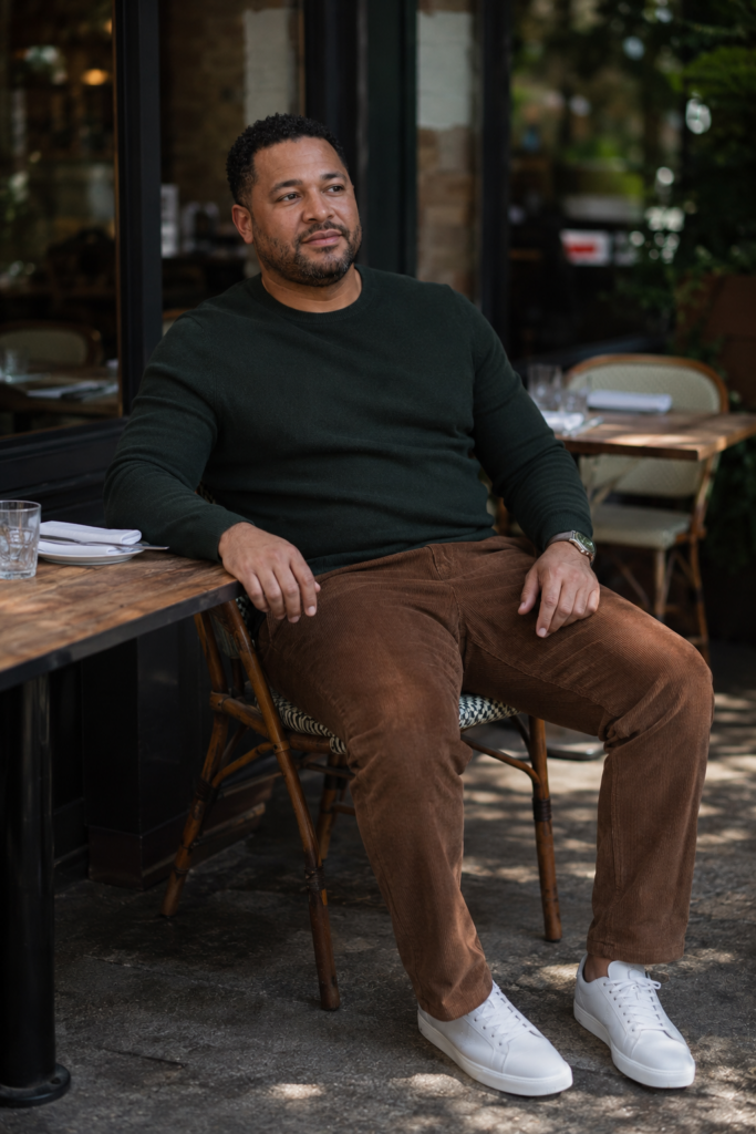 Brown Corduroy Trousers With a Fitted Green Crewneck and White Sneakers