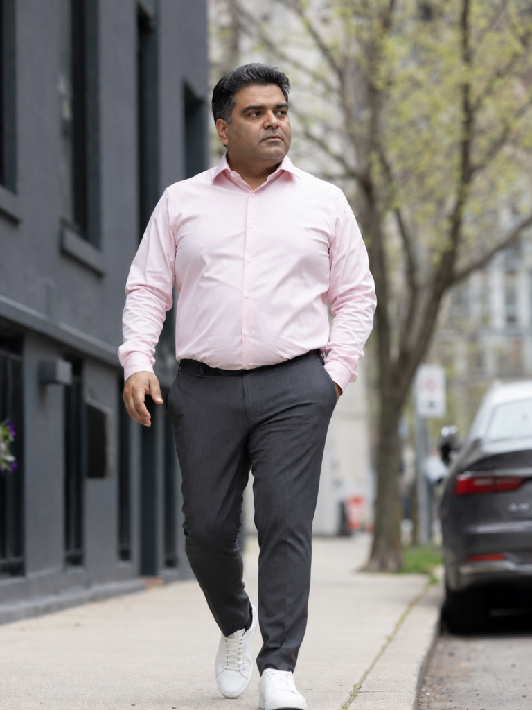 Charcoal Slim Dress Trousers With a Fitted Pale Pink Poplin Shirt and White Leather Sneakers