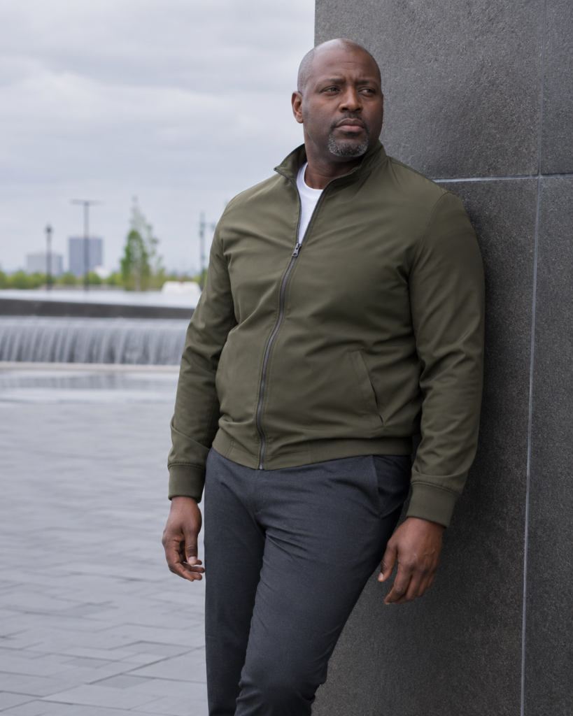 Charcoal Slim Suit Trousers With a Fitted Olive Zip-Up Jacket and White Tee