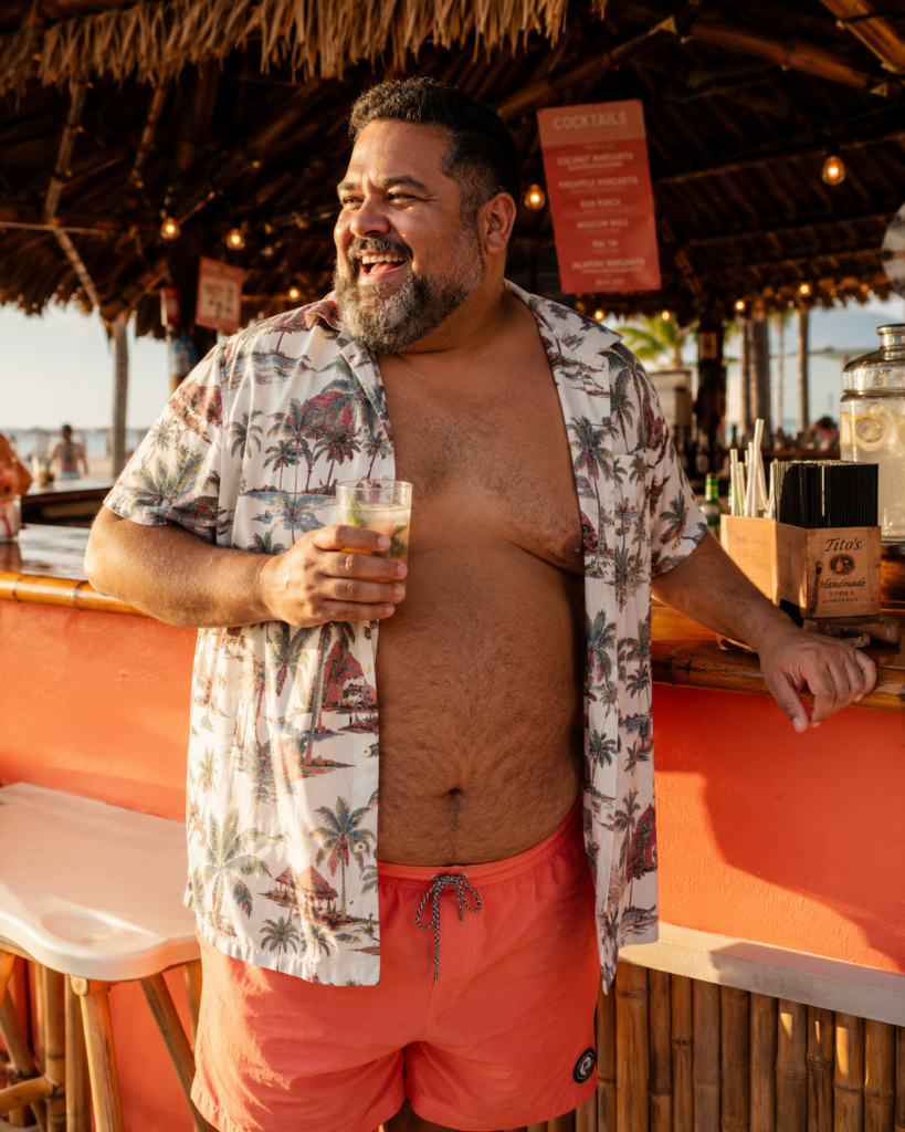 Coral Swim Trunks With an Unbuttoned Short-Sleeve Hawaiian Shirt