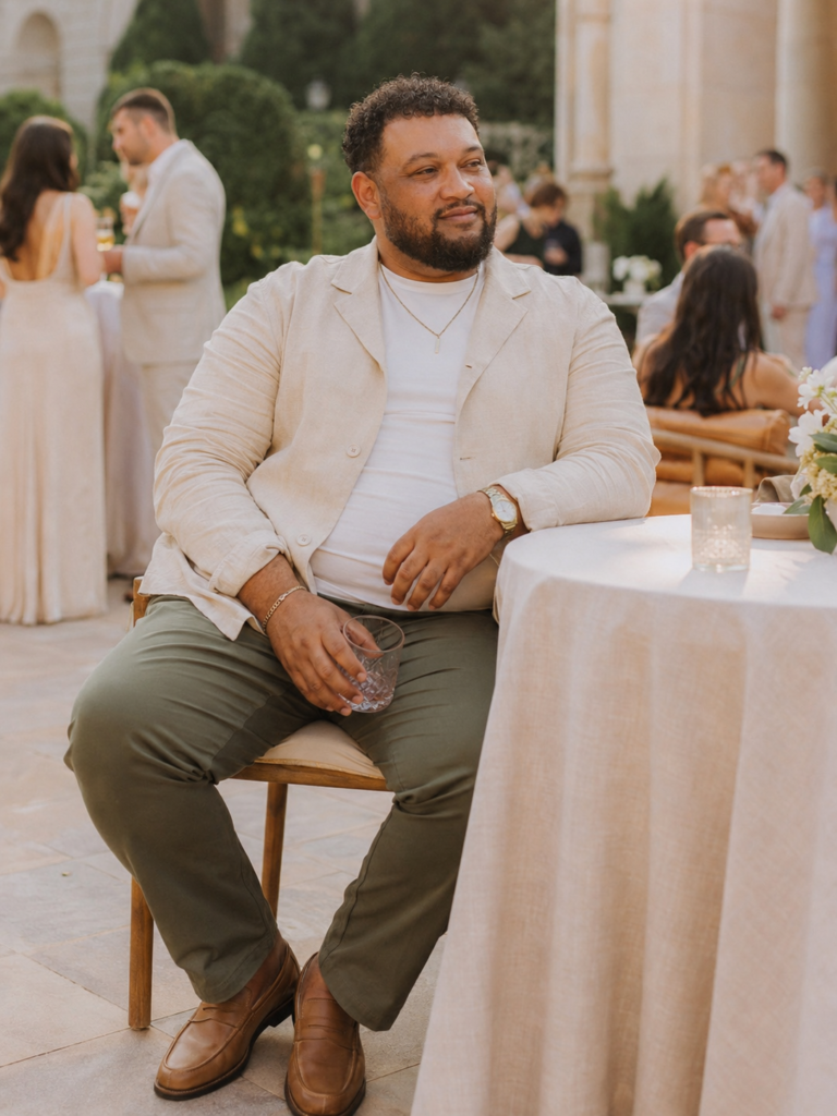 Cream Linen Shirt Jacket Over a White Tee With Olive Relaxed Trousers and Tan Loafers