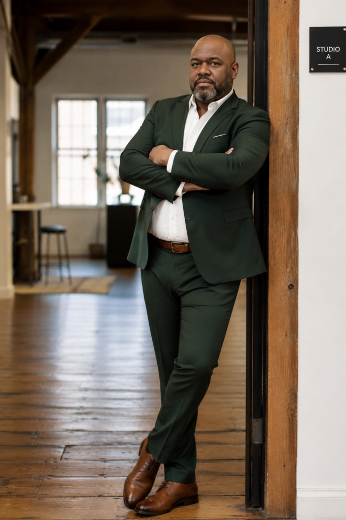 Forest Green Suit With a Brown Leather Belt and Matching Shoes