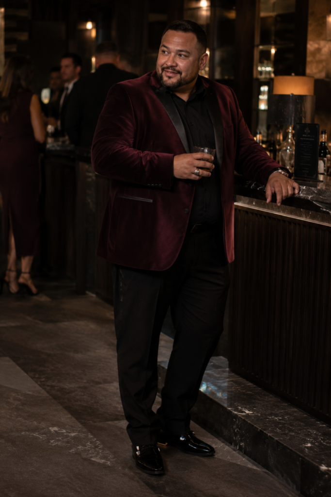 Merlot Velvet Blazer With Black Dress Trousers, a Black Shirt, and Patent Leather Shoes