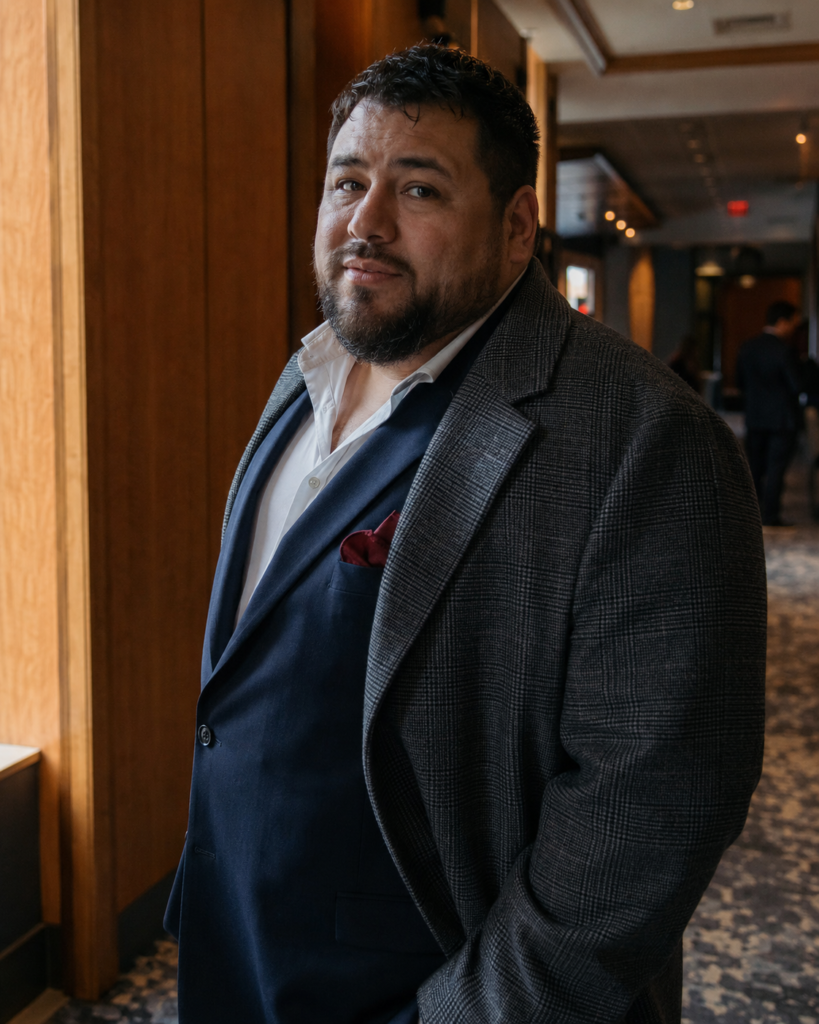 Navy Suit With a Grey Flannel Overcoat and a Burgundy Pocket Square