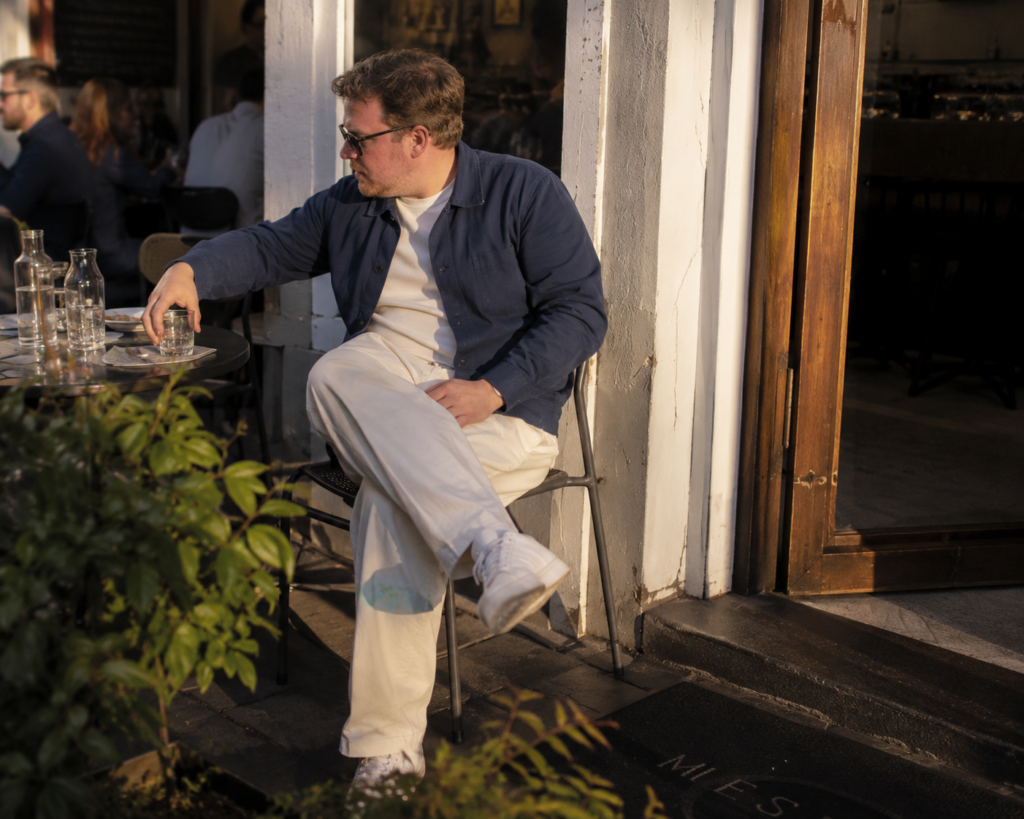 Relaxed Linen Trousers with a Cropped Coach Jacket and Clean Leather Sneakers
