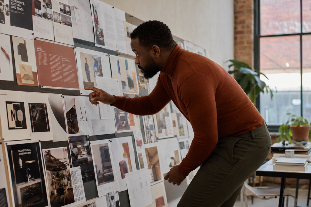 The Rust Merino Turtleneck and Dark Olive Straight Trouser for a Design Studio