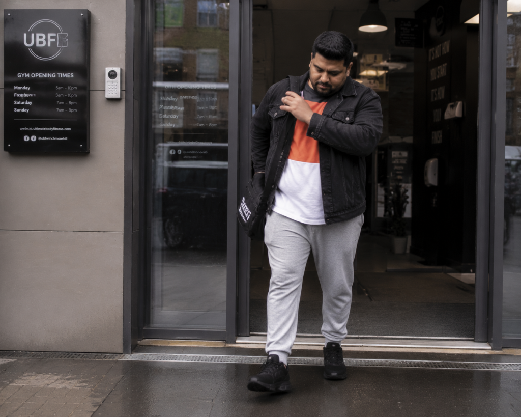 Washed Black Denim Jacket Over a Bold Color Block Tee with Grey Sweatpants